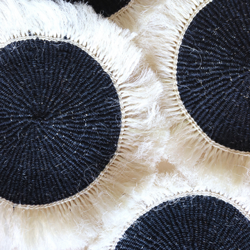 Black sisal placemats with white fringe