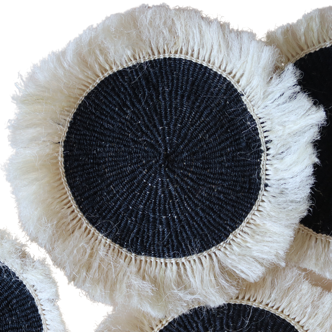 Black sisal placemats with white fringe