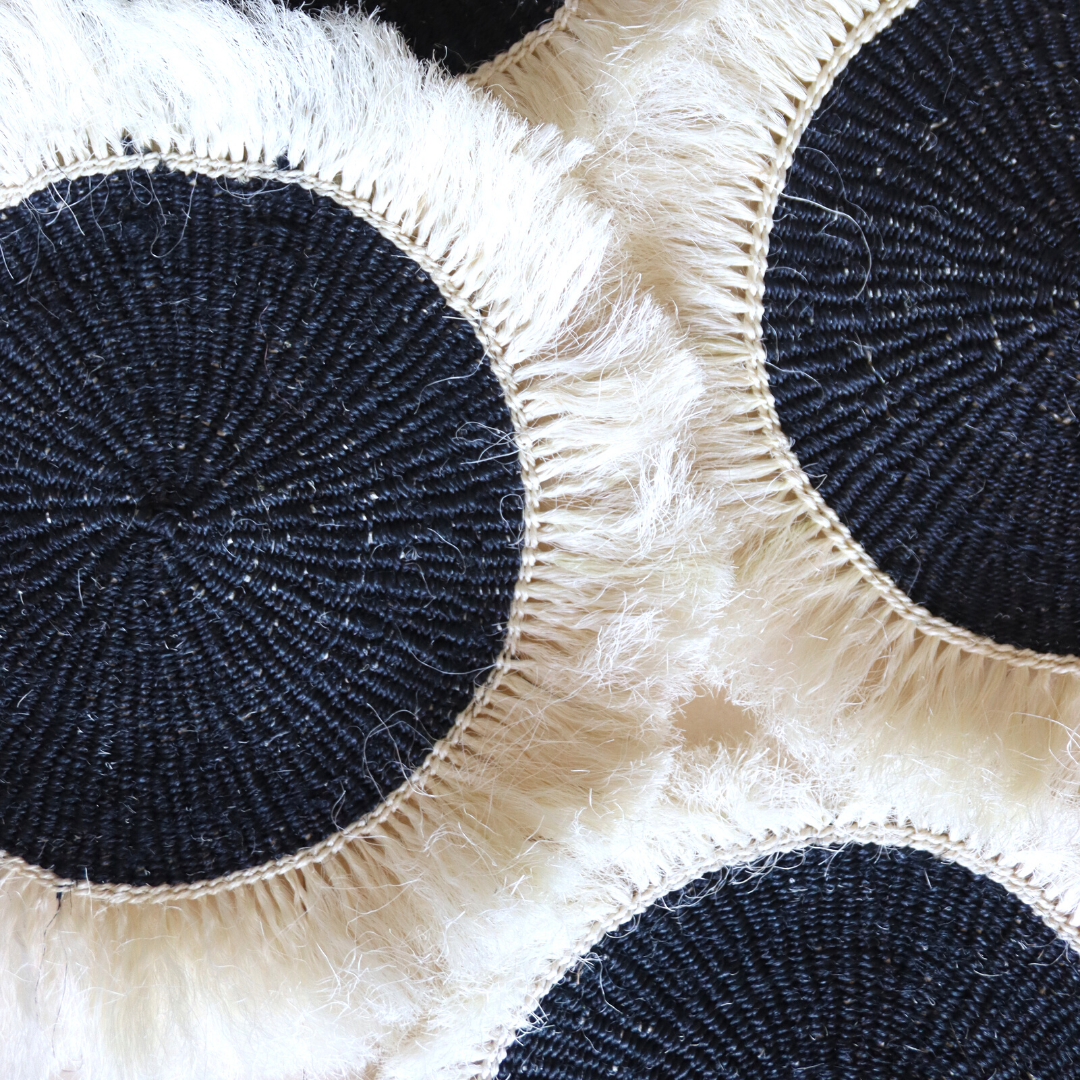 Black sisal placemats with white fringe