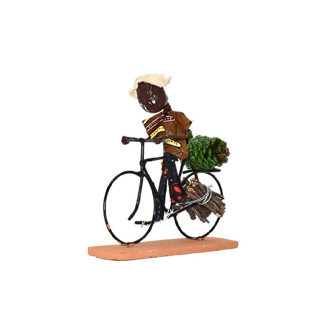 Handcrafted Cyclist Sculpture | Firewood Collector